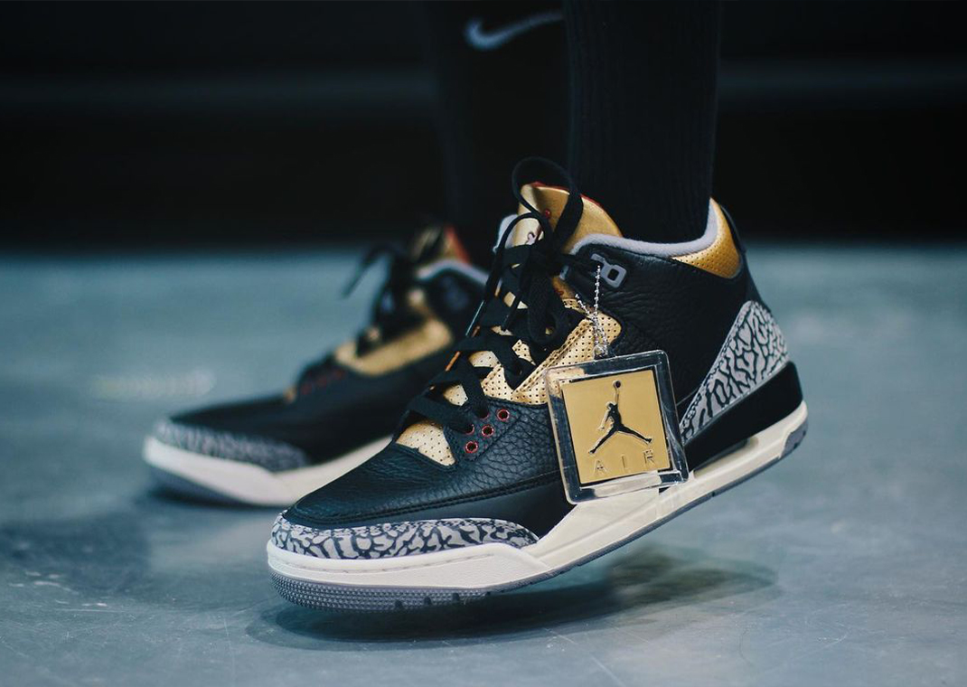 Metallic Gold Accents The Air Jordan 3 Black Cement Sneaker News